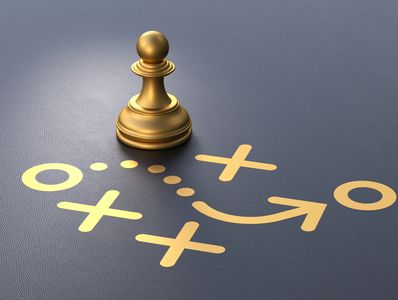 Golden chess pawn on a tactical game plan.