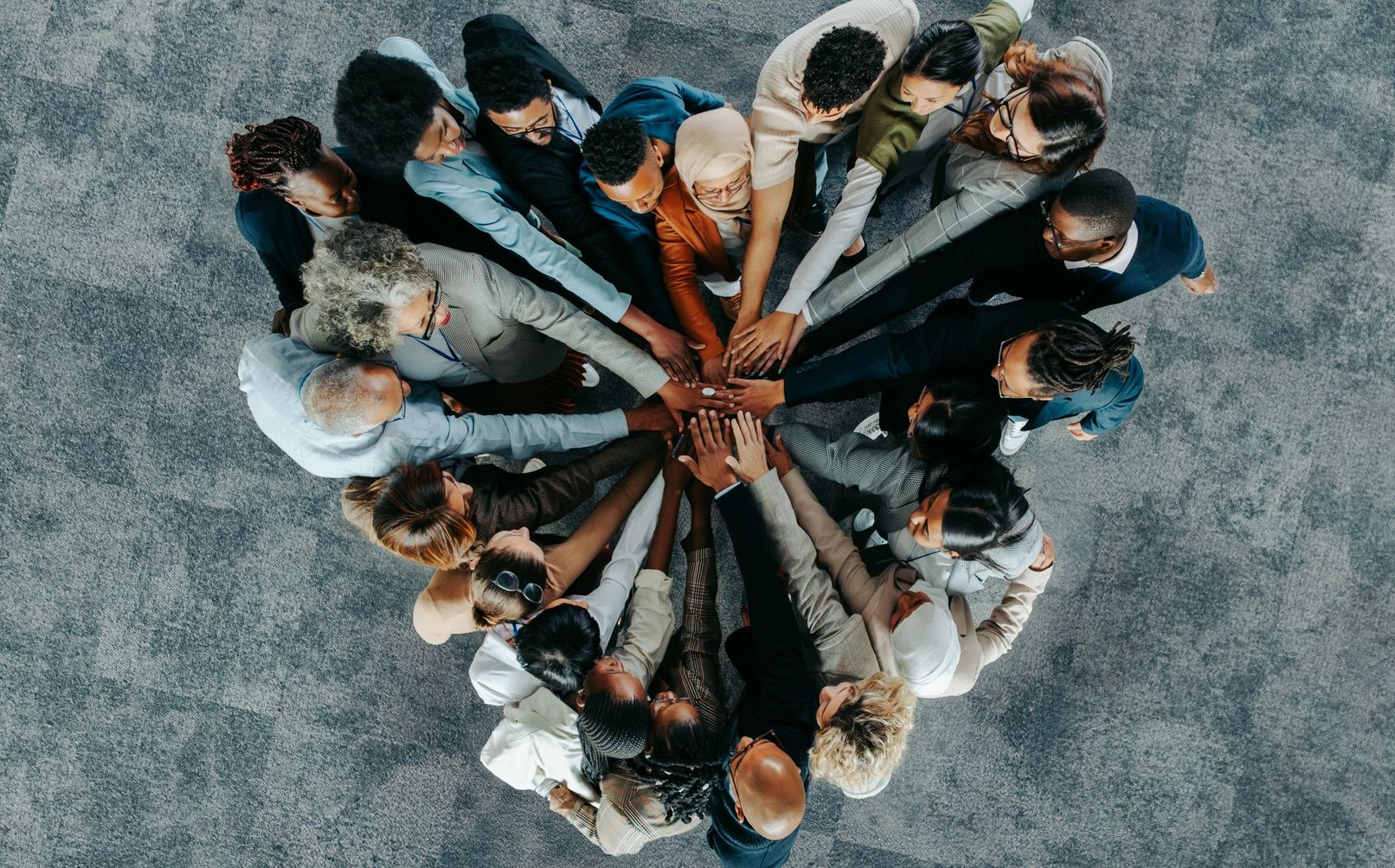 A group of people in the shape of a heart, working together for a mission