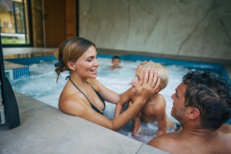 Family Relaxing in the Indoor Pool on Vacation