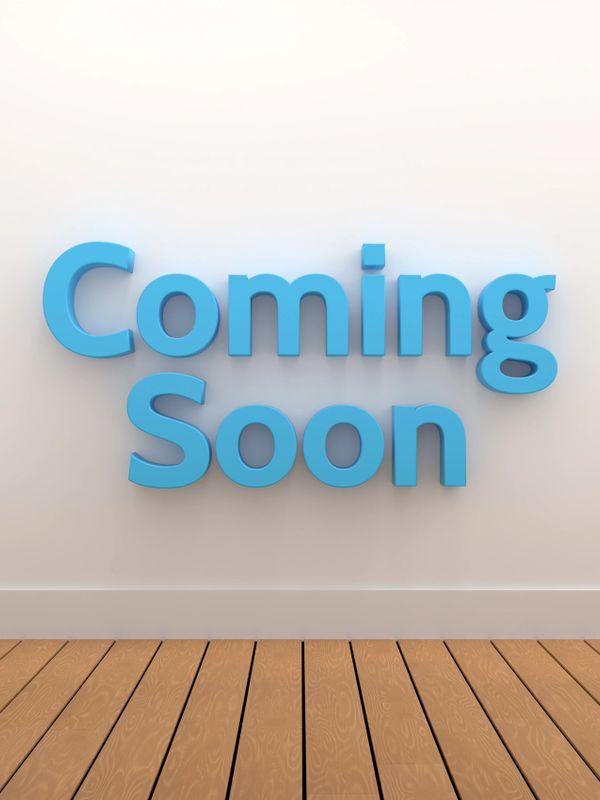 Blue 3D text "Coming Soon" on a white wall above wooden floor.