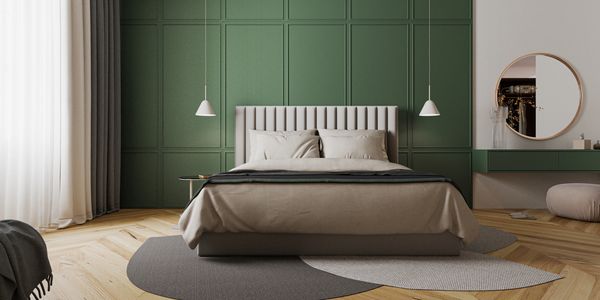 picture of bedroom with a green wall and fancy bed it has area rugs and hanging lights