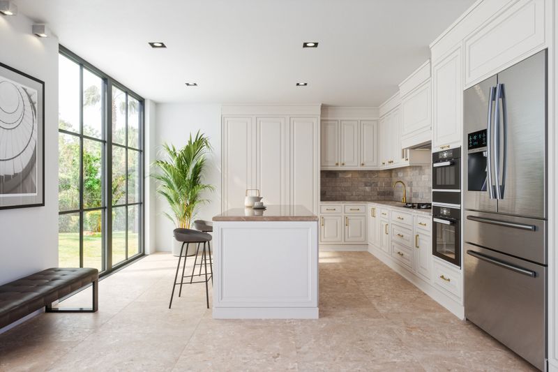 Modern kitchen interior featuring an island, sink, cabinets, kitchen appliances, and ceramic flooring in a new luxury home.