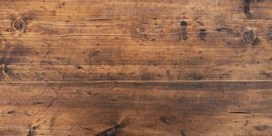Rustic wooden surface with natural grain and knots.