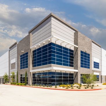 Commercial building with large dark windows