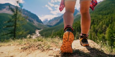Person hiking on a mountain trail.