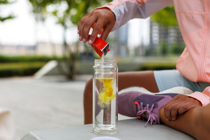 Young sport woman have her before and after training routine with healthy supplementation.