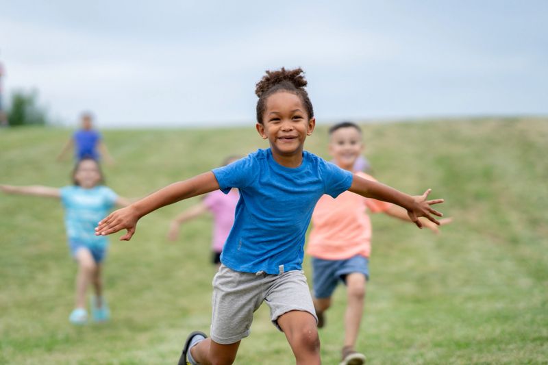 Smiling child in a colorful park during a photography session