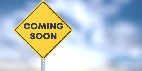 Yellow diamond sign says "COMING SOON".