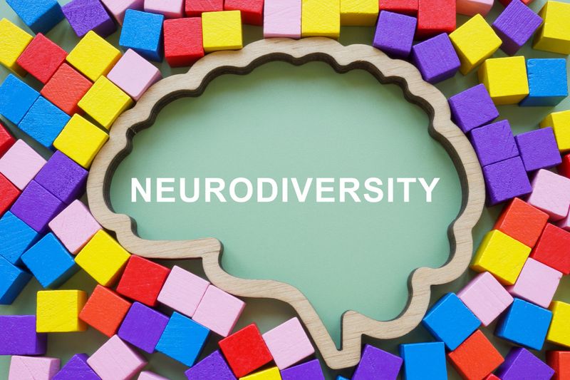 Colored cubes and brain outline with word neurodiversity.