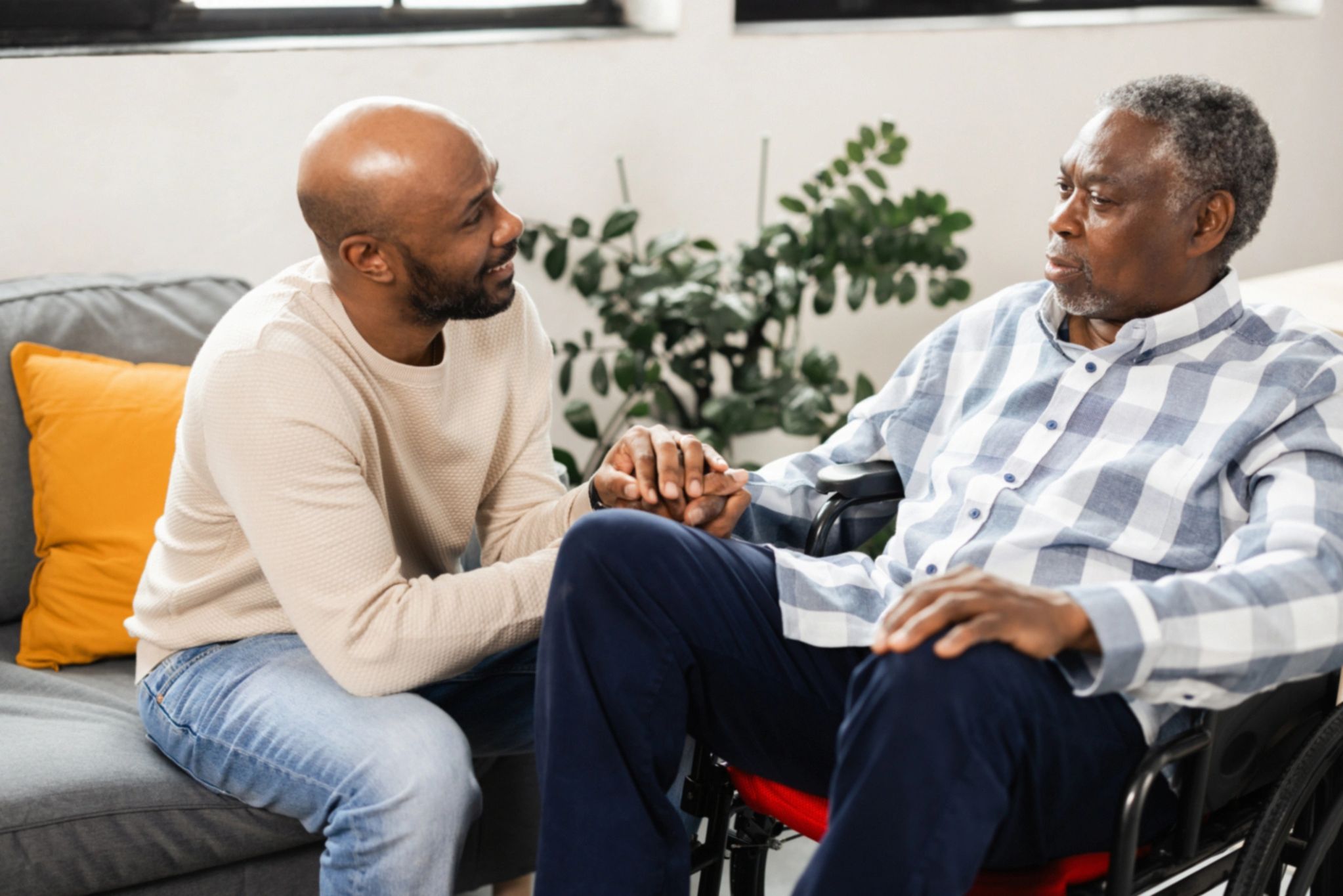 Senior receiving thoughtful support in a comfortable home-like space
