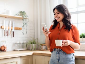 Woman smiling doing virtual therapy with Steven Ayers, a therapist that specializes in women's menta