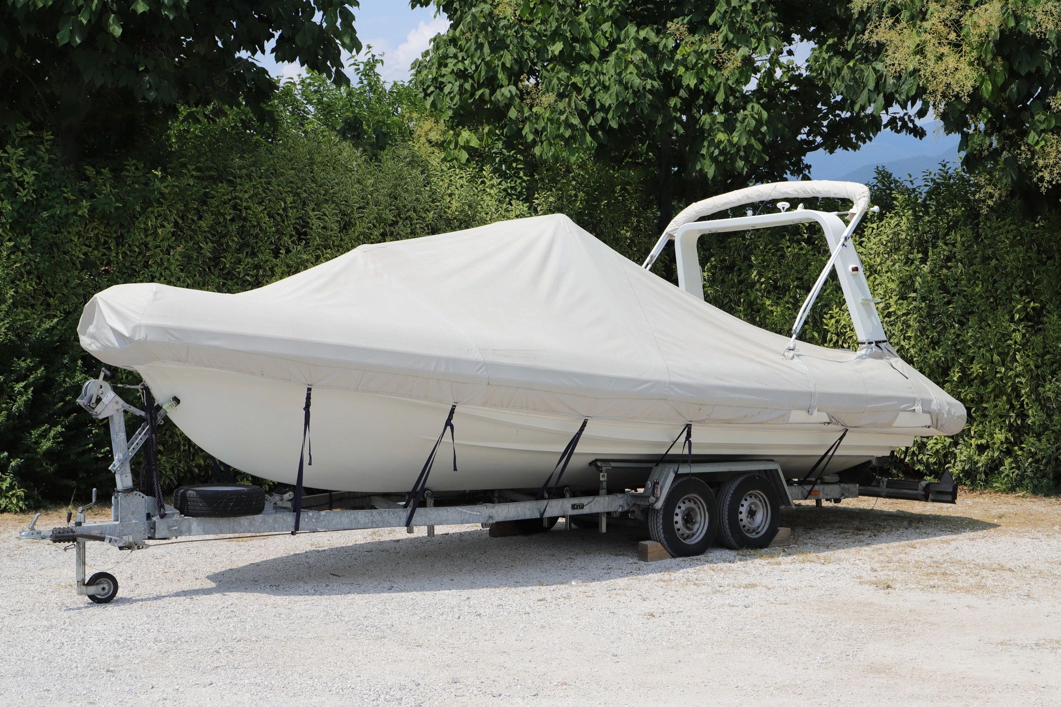 Outdoor boat on trailer covered