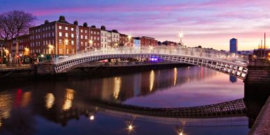 Dublin city bridge over the river Liffey at dusk.