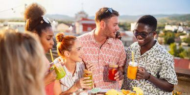 Group of friends enjoying drinks outdoors.