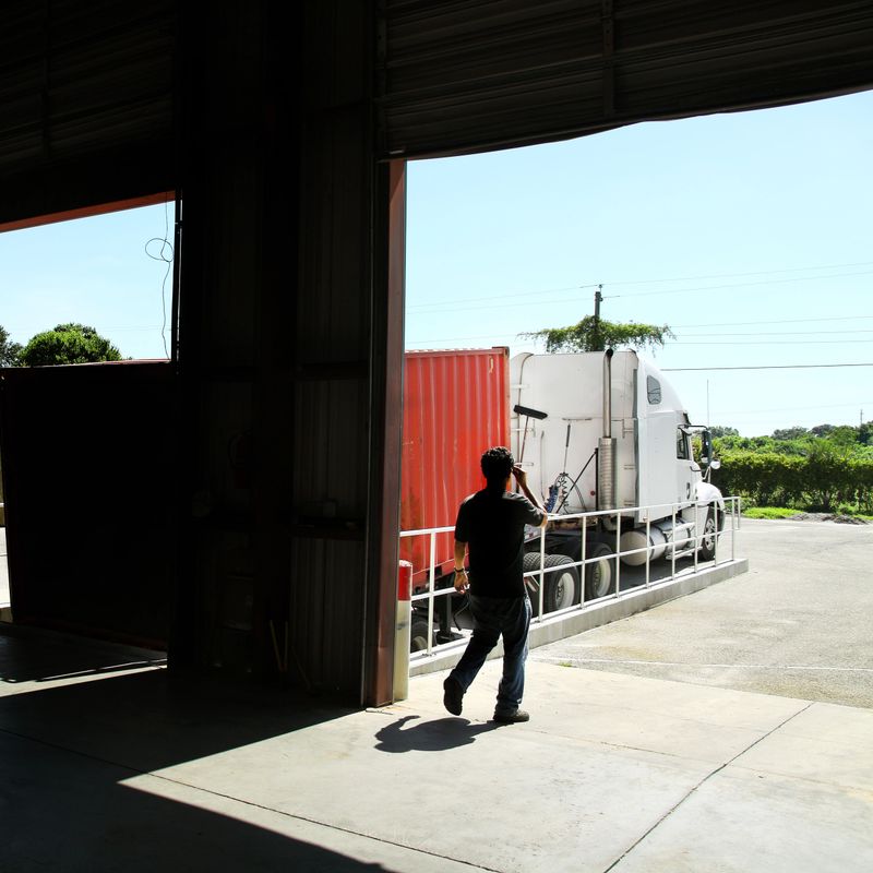 Commercial truck parked at warehouse gate