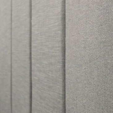 Close-up of textured gray fabric panels arranged vertically.