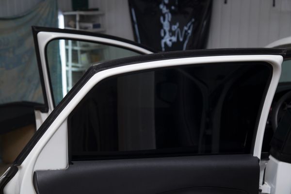 door glass with nano-carbon window tint