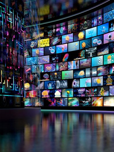Curved wall of digital AI-themed screens in a futuristic room.