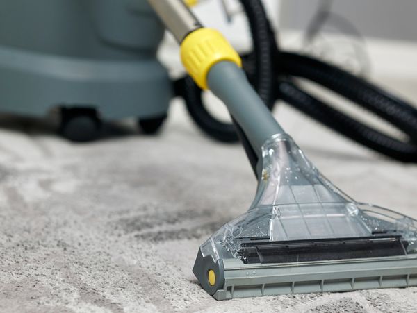 Carpet cleaning with a vacuum tool.