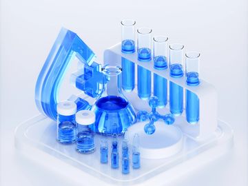 Blue liquid-filled scientific glassware arranged on a white platform.