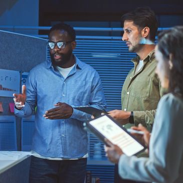 Team discussing data in an office meeting.