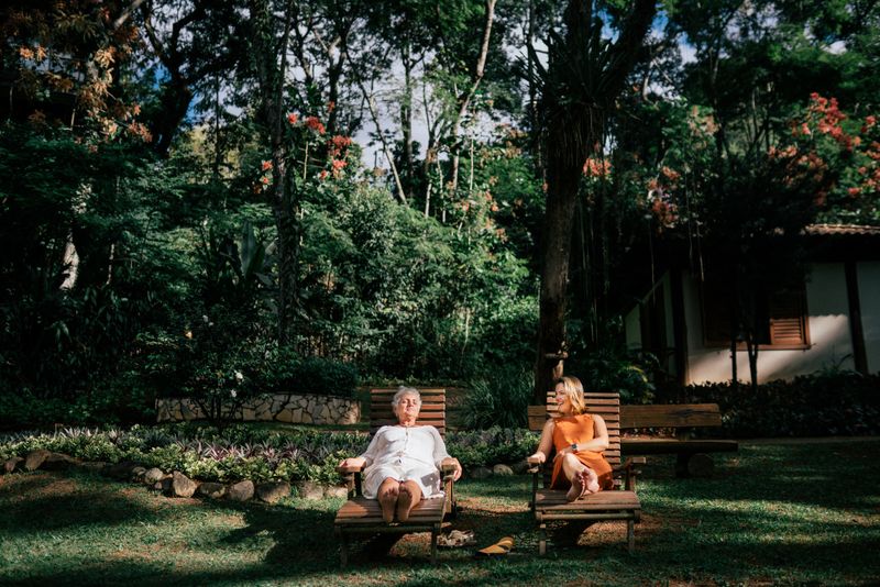 Mom and her daughter enjoying a beautiful garden and relaxing in a luxury spa during holidays