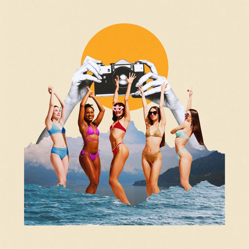 Contemporary art collage. Women in bikinis dancing, while hands with camera frame scene against backdrop of ocean waves, mountains, and large yellow sun. Concept of summertime, holidays, relaxation.