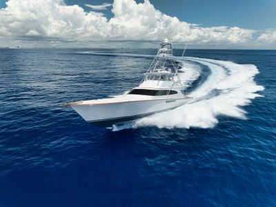 A white yacht speeding across the ocean.