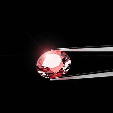 A pink gemstone held by tweezers against a black background.