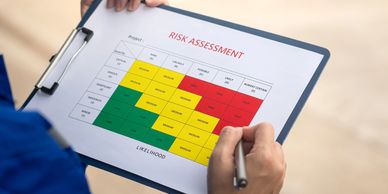 A consultant reviewing a risk assessment matrix on a clipboard.