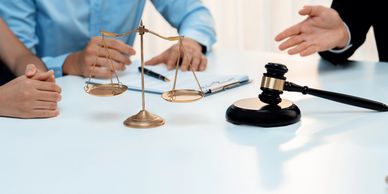 Legal consultation with scales of justice and gavel.