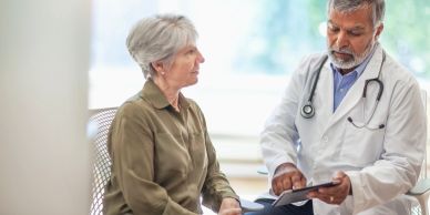 Doctor consulting an elderly patient.