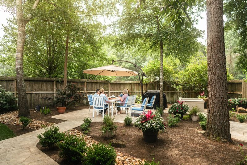 Senior friends sitting in the backyard. They are having coffee, dessert and drinks together. Part of a series where we follow a group of seniors living in the larger Houston area, Texas.