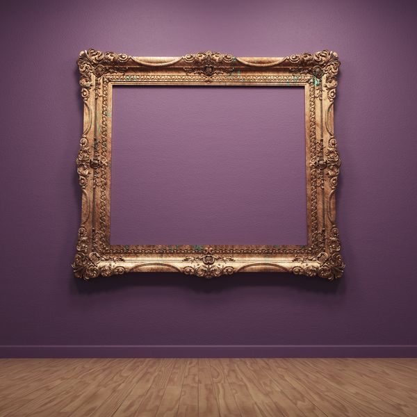 An ornate golden picture frame on a purple wall with wooden floor.