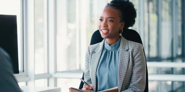 Black lesbian professional participating in leadership and networking opportunities through BEL