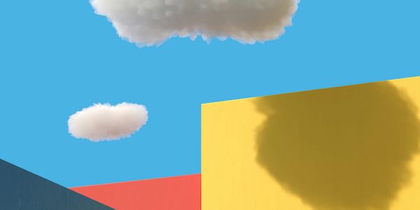 Minimalist scene with colorful geometric shapes and fluffy clouds.