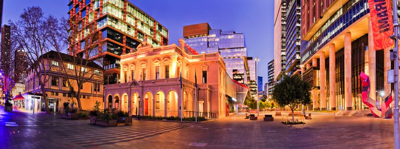 Short urban city architecture panorama of City of Parramatta town hall council building at sunset.