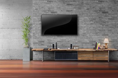 Flat screen tv mounted into stone. 