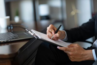 Man writing on notepad