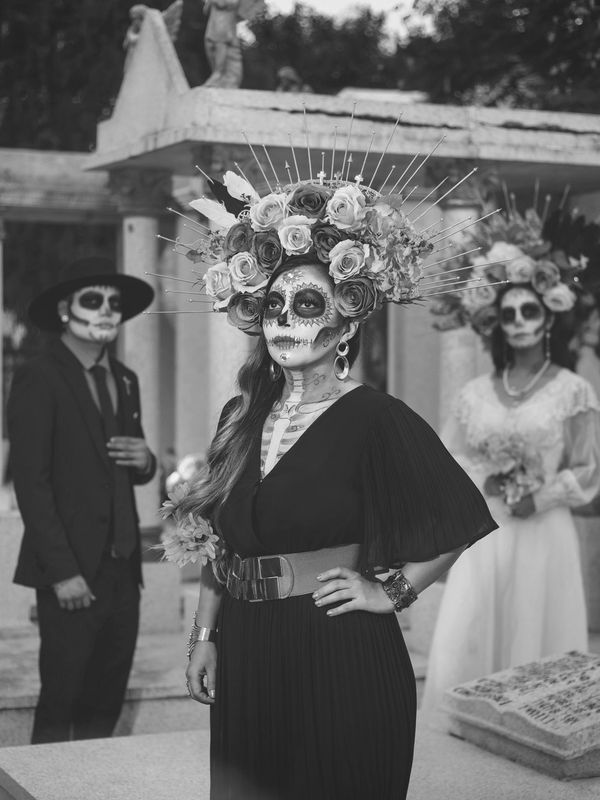 People in Day of the Dead makeup and costumes.