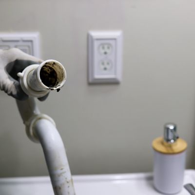 dirty p-trap ready to be cleaned and installed