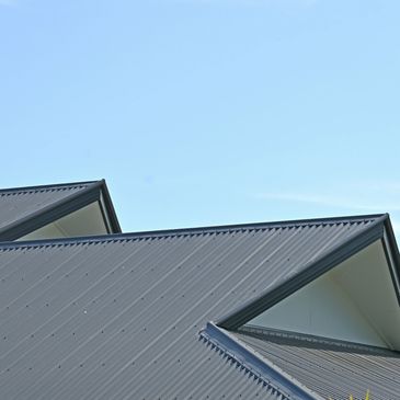 Newly installed standing seam metal roof in a black color on a residential home Deerfield Beach, FL