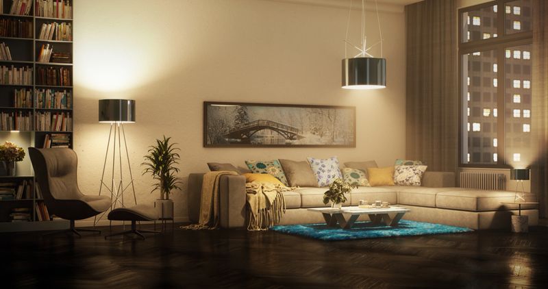 Digitally generated beautifully designed modern living room bathed in the warm glow of dusk. The room features a comfortable sectional sofa adorned with vibrant blue and yellow cushions, complemented by sleek, contemporary furnishings. Soft lighting from elegant floor and pendant lamps creates a cozy and inviting atmosphere, perfect for relaxing or entertaining. The large windows allow the city lights to peek through, adding a touch of urban sophistication to the space. This scene perfectly captures the essence of a modern, cozy home with stylish blue accents.

The scene was created in Autodesk® 3ds Max 2025 with V-Ray 6 and rendered with photorealistic shaders and lighting in Chaos® Vantage with some post-production added.