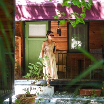 Woman walking out tiny home front door