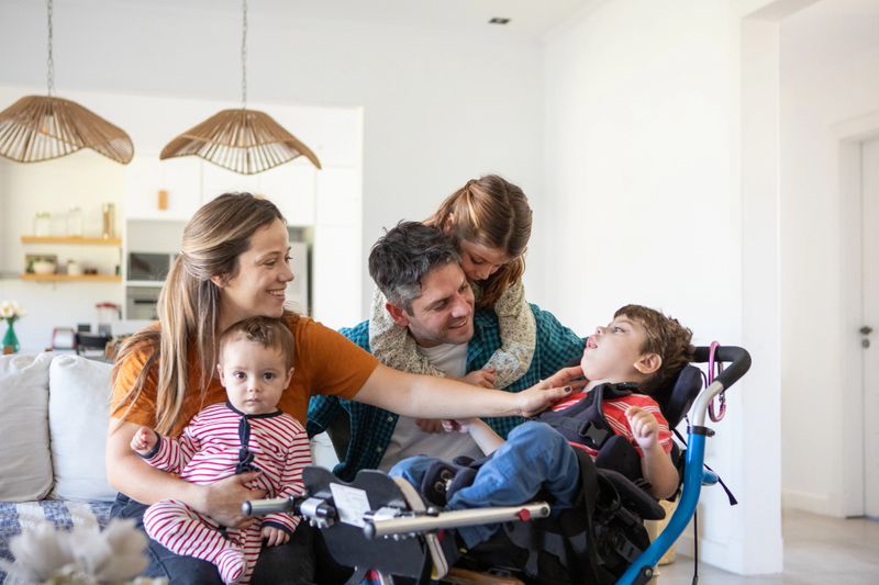 Portrait of parents with three small children at home - Buenos Aires - Argentina