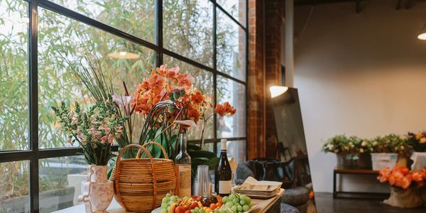 an open store front window with flower