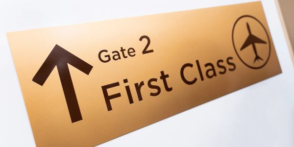 Sign pointing to Gate 2 First Class.
