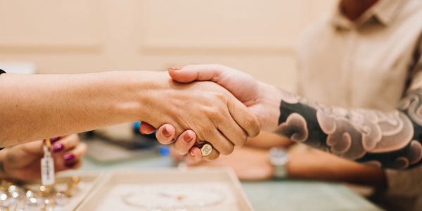 A two woman handset each other