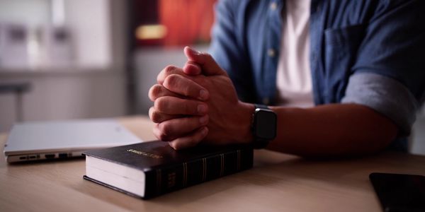 Hands and Bible