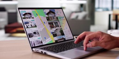 Laptop showing real estate listings